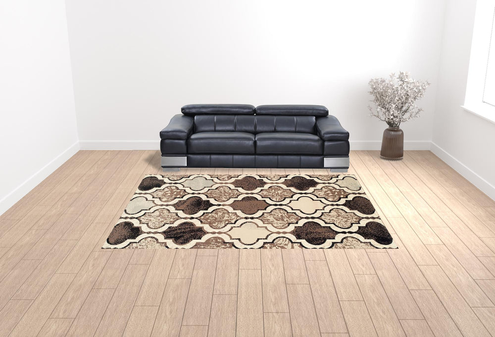 Homeroots 9' X 12' Ivory Quatrefoil Power Loom Distressed Stain Resistant Area Rug  Polypropylene 487244