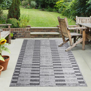 Homeroots 7' X 9' Grey Striped Stain Resistant Non Skid Indoor Outdoor Area Rug  Polypropylene 487256