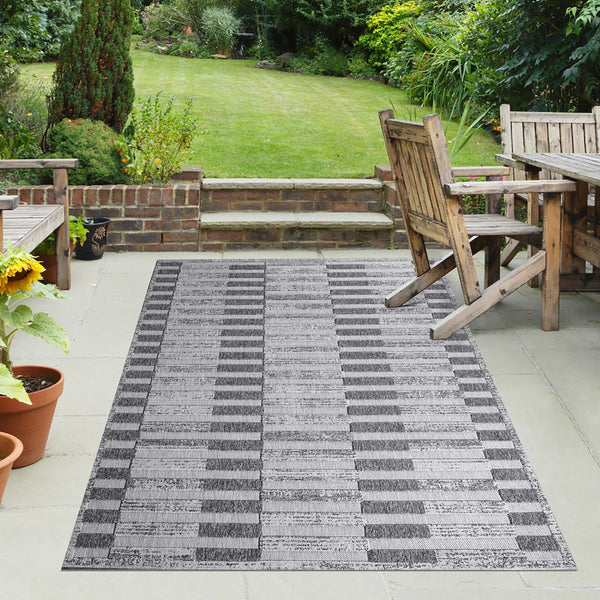 Homeroots 7' X 9' Grey Striped Stain Resistant Non Skid Indoor Outdoor Area Rug  Polypropylene 487256