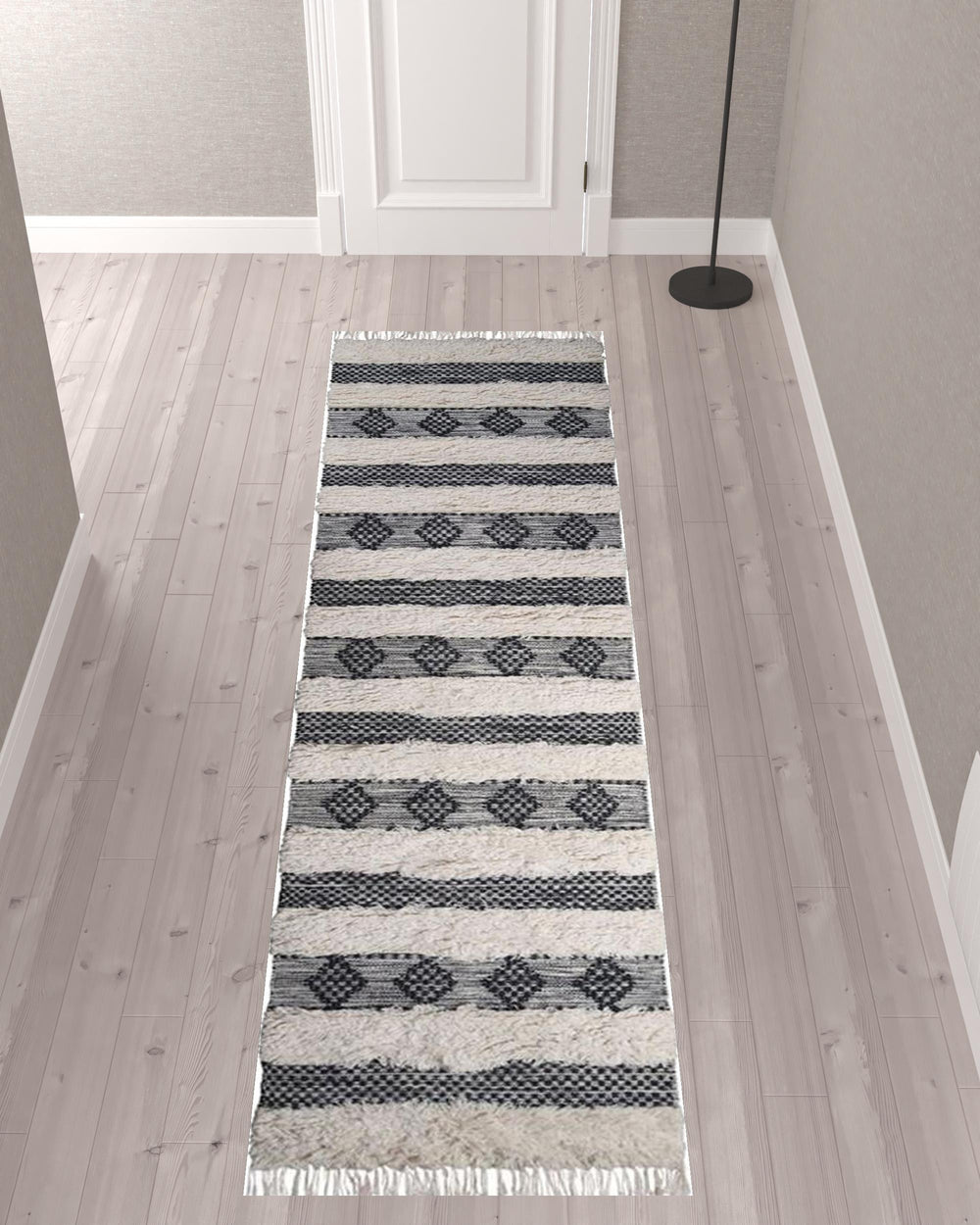 Homeroots 10' Black And Ivory Wool Striped Flatweave Handmade Stain Resistant Runner Rug With Fringe  Wool 487271