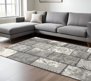 HomeRoots 4' Gray and Ivory Damask Area Rug - Timeless Elegance, Machine Washable, Durable for High-Traffic Areas 7' X 9' 487661
