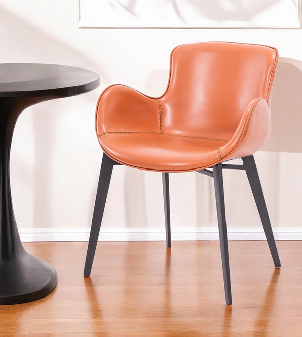 Homeroots Terra Cotta And Black Upholstered Faux Leather Dining Arm Chair  Metal 487984