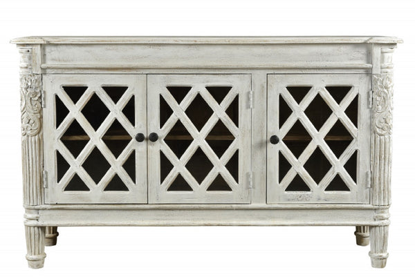 HomeRoots 58" Elegant White Distressed Solid Wood Sideboard with Glass Doors & Carved Scrollwork for Storage 488487