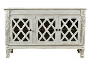 HomeRoots 58" Elegant White Distressed Solid Wood Sideboard with Glass Doors & Carved Scrollwork for Storage 488487