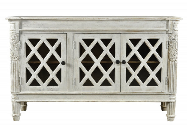 HomeRoots 58" Elegant White Distressed Solid Wood Sideboard with Glass Doors & Carved Scrollwork for Storage 488487