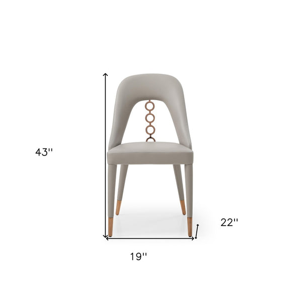 HomeRoots Set of Two Light Gray Faux Leather Dining Chairs with Chic Rose Gold Accents for Modern Spaces 488512