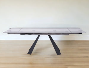 Homeroots 63" Clear And Black Glass And Metal Drop Leaf Pedestal Base Dining Table   488514