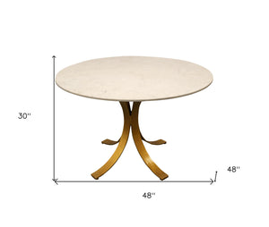 Homeroots 48" Ivory And Brass Rounded Marble And Iron Pedestal Base Dining Table   488682