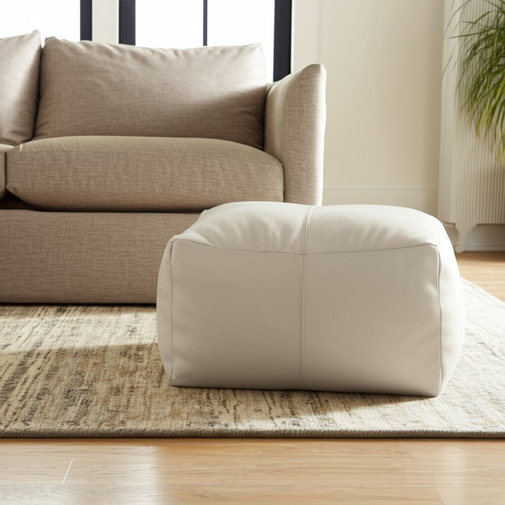 HomeRoots 22" Ivory Leather Pouf Ottoman - Chic Multi-Purpose Footrest & Stylish Extra Seating for Any Space 488747