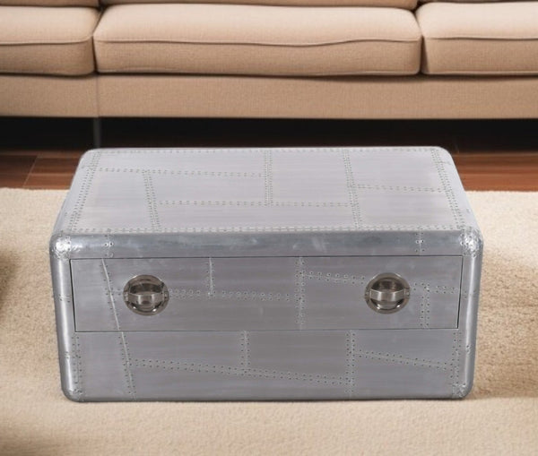 HomeRoots 40" Silver Aluminum Coffee Table - Vintage Aviation Style with Drawer for Modern Living Spaces 488787