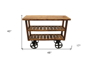 Homeroots 48" Brown And Black Solid Wood Distressed Wheel Console Table With Storage   488851