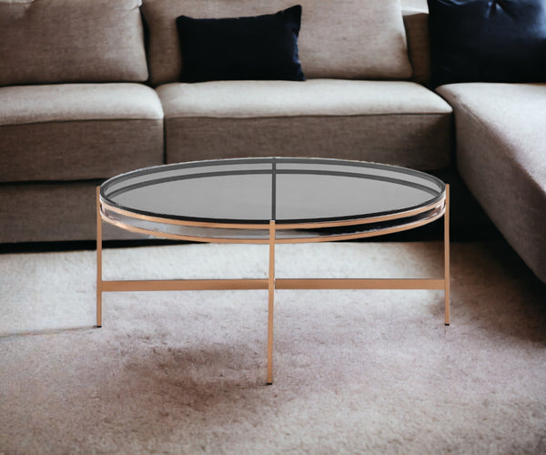 Homeroots 35" Gold And Smoked Glass Round Coffee Table   489061