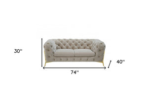 HomeRoots 74" Beige Velvet Chesterfield Loveseat with Gold Legs - Luxurious Tufted Design for Stylish Comfort 489282