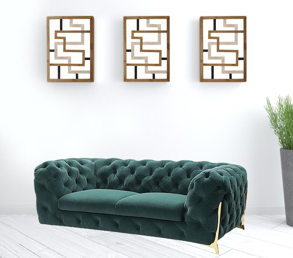 HomeRoots 74" Elegant Emerald Green Velvet Chesterfield Loveseat with Gold Legs for Modern Glam Spaces 489283