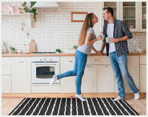HomeRoots 2' X 5' Black And White Striped Vinyl Area Rug - UV Protected, Water-Resistant, Non-Slip Design! 489511