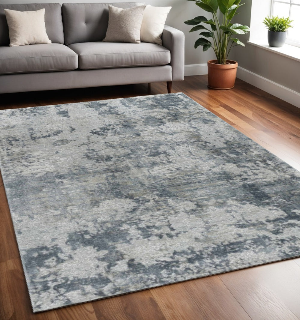 HomeRoots 5' Blue Abstract Power Loom Area Rug - Stylish, Durable, and Stain-Resistant for Modern Homes 5' X 8' 490422