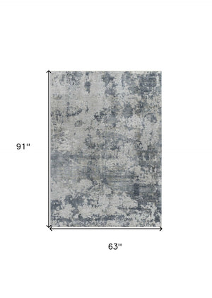 HomeRoots 5' Blue Abstract Power Loom Area Rug - Stylish, Durable, and Stain-Resistant for Modern Homes 5' X 8' 490422