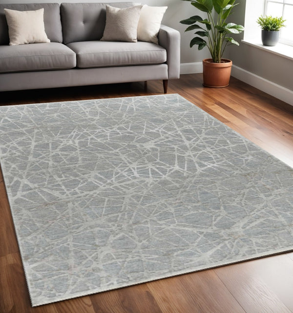 HomeRoots 5' Turquoise Abstract Area Rug - Power Loomed, Stain Resistant, Ideal for High-Traffic Homes 5' X 8' 490440