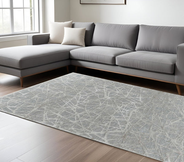 HomeRoots 5' Turquoise Abstract Area Rug - Power Loomed, Stain Resistant, Ideal for High-Traffic Homes 8' X 10' 490441
