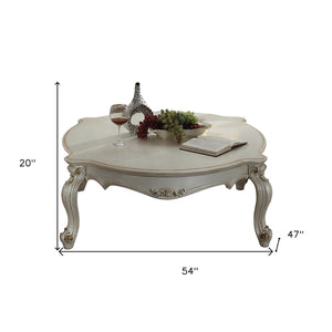 Homeroots 54" Pearl Solid And Manufactured Wood And Polyresin Coffee Table   490553