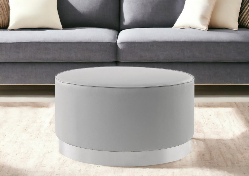 HomeRoots 31" Modern Round Cocktail Ottoman with Silver Base - Chic Faux Leather Accent for Living Room Elegance Grey PU/Chrome, Leather PU Leather PU 490600