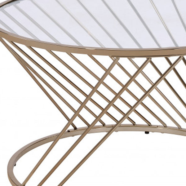 Homeroots 32" Champagne And Clear Glass And Metal Round Coffee Table   490741