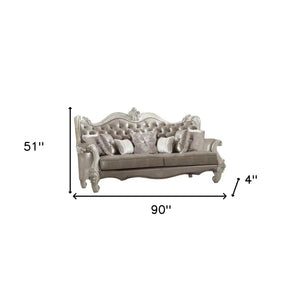 Homeroots 90" Gray Faux Leather Curved Sofa And Toss Pillows With Bone Legs   490989