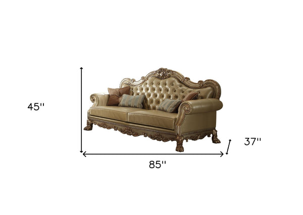 HomeRoots 85" Bone Faux Leather Sofa with Toss Pillows - Elegant Carved Design, Comfortable Seating for 3 490997