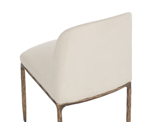 Sunpan NESTOR Dining Chair - Plush Upholstered Comfort with Artisan Hammered Details & Antique Brass Finish 112295