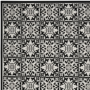 Homeroots 7' X 10' Black And White Fleur De Lis Stain Resistant Non Skid Area Rug  Polypropylene 505651
