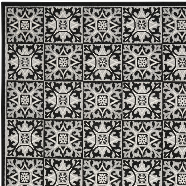 Homeroots 7' X 10' Black And White Fleur De Lis Stain Resistant Non Skid Area Rug  Polypropylene 505651