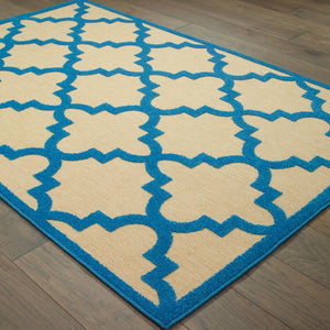 HomeRoots 5' Green Geometric Indoor/Outdoor Area Rug - Stain Resistant, Modern Style for High-Traffic Spaces Sand/ Blue 5'3" x 7'6" 506800