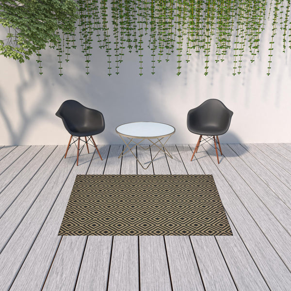 Homeroots 5' X 8' Black And Tan Geometric Stain Resistant Indoor Outdoor Area Rug  Polypropylene 507008