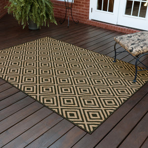 Homeroots 5' X 8' Black And Tan Geometric Stain Resistant Indoor Outdoor Area Rug  Polypropylene 507008