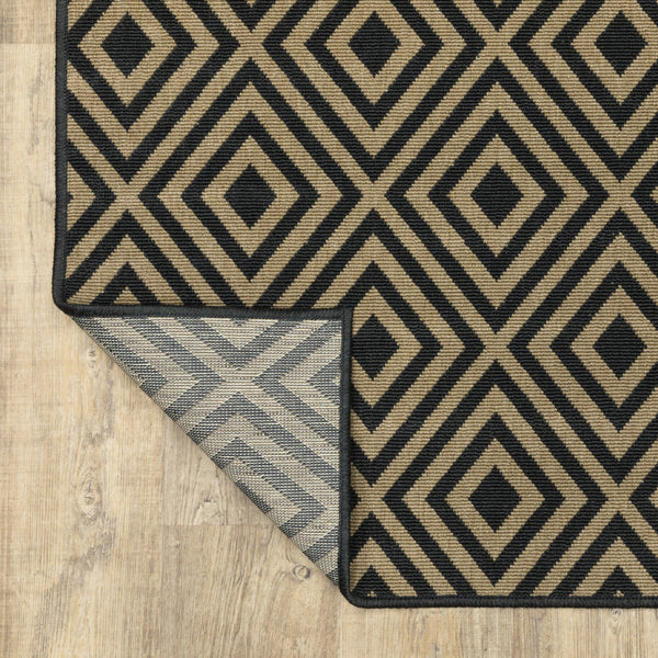 Homeroots 7' X 10' Black And Tan Geometric Stain Resistant Indoor Outdoor Area Rug  Polypropylene 507009