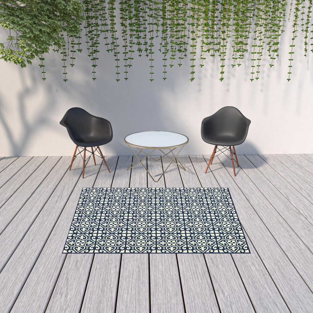 HomeRoots 5' Indoor Outdoor Area Rug in Ivory and Blue – Stylish Geometric Design, Durable, Stain Resistant 5'3" x 7'6" 507044