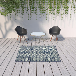 HomeRoots 5' Indoor Outdoor Area Rug in Ivory and Blue – Stylish Geometric Design, Durable, Stain Resistant 5'3" x 7'6" 507044