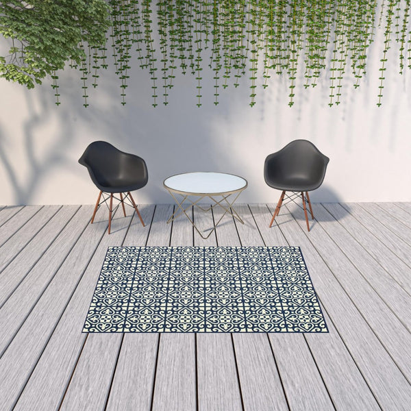 HomeRoots 5' Indoor Outdoor Area Rug in Ivory and Blue – Stylish Geometric Design, Durable, Stain Resistant 5'3" x 7'6" 507044