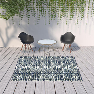 HomeRoots 5' Indoor Outdoor Area Rug in Ivory and Blue – Stylish Geometric Design, Durable, Stain Resistant 6'7" x 9'6" 507045