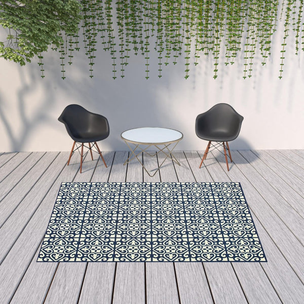 HomeRoots 5' Indoor Outdoor Area Rug in Ivory and Blue – Stylish Geometric Design, Durable, Stain Resistant 6'7" x 9'6" 507045
