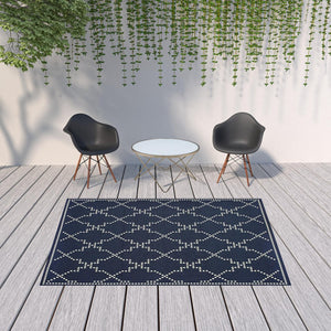 HomeRoots 5' Indoor Outdoor Geometric Area Rug - Stain Resistant Blue and Ivory Design for Versatile Spaces Navy/ Ivory 6'7" x 9'6" 507072