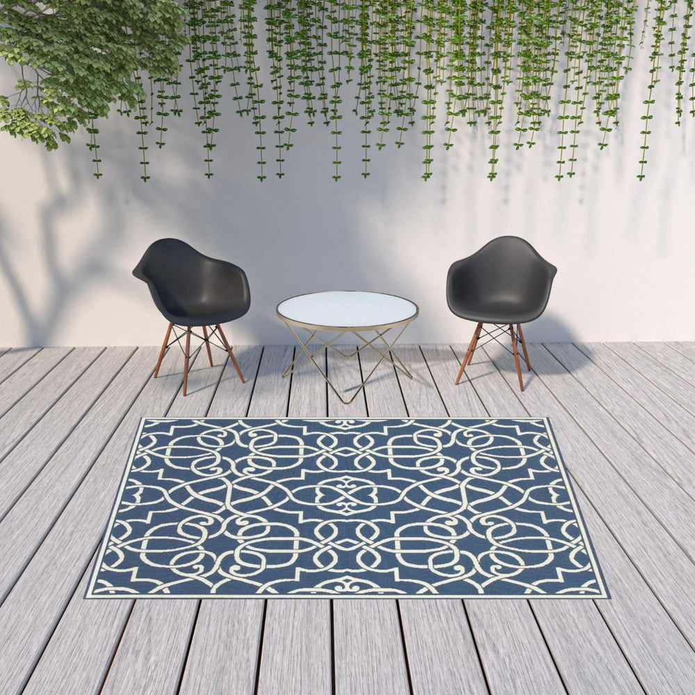 HomeRoots 5' Blue and Ivory Geometric Area Rug – Stain Resistant, Stylish Design for High-Traffic Spaces 6'7" x 9'6" 507105