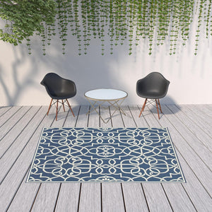 HomeRoots 5' Blue and Ivory Geometric Area Rug – Stain Resistant, Stylish Design for High-Traffic Spaces 6'7" x 9'6" 507105