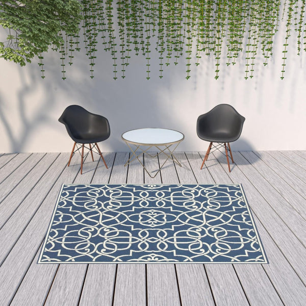 HomeRoots 5' Blue and Ivory Geometric Area Rug – Stain Resistant, Stylish Design for High-Traffic Spaces 6'7" x 9'6" 507105