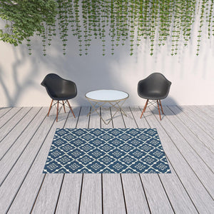 HomeRoots 5' Blue and Ivory Floral Area Rug - Stain Resistant, Durable Design for Indoor and Outdoor Spaces 5'3" x 7'6" 507160