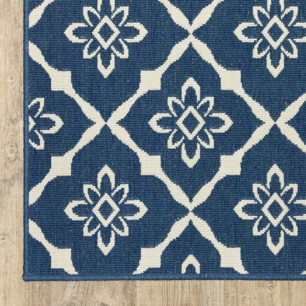 HomeRoots 5' Blue and Ivory Floral Area Rug - Stain Resistant, Durable Design for Indoor and Outdoor Spaces 5'3" x 7'6" 507160