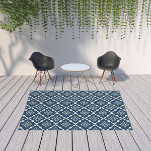 HomeRoots 5' Blue and Ivory Floral Area Rug - Stain Resistant, Durable Design for Indoor and Outdoor Spaces 6'7" x 9'6" 507161