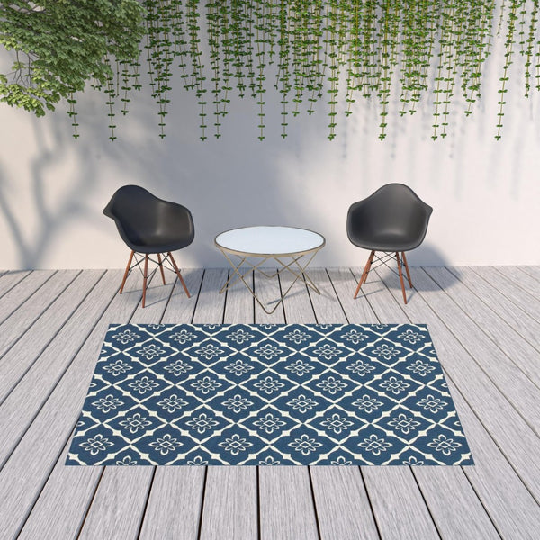 HomeRoots 5' Blue and Ivory Floral Area Rug - Stain Resistant, Durable Design for Indoor and Outdoor Spaces 6'7" x 9'6" 507161