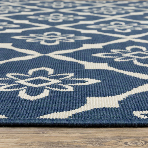 HomeRoots 5' Blue and Ivory Floral Area Rug - Stain Resistant, Durable Design for Indoor and Outdoor Spaces 6'7" x 9'6" 507161