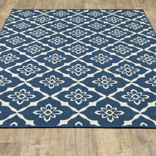 HomeRoots 5' Blue and Ivory Floral Area Rug - Stain Resistant, Durable Design for Indoor and Outdoor Spaces 6'7" x 9'6" 507161